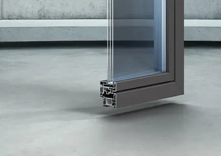 Kömmerling Horizon PVC window profile in cross-section, dark tone and flush sash — Pulsar Windows