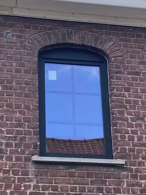 Dark-toned windows replaced on a brick house in Opwijk — Pulsar Windows