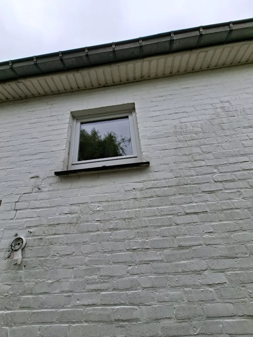 Before: old small white gable window