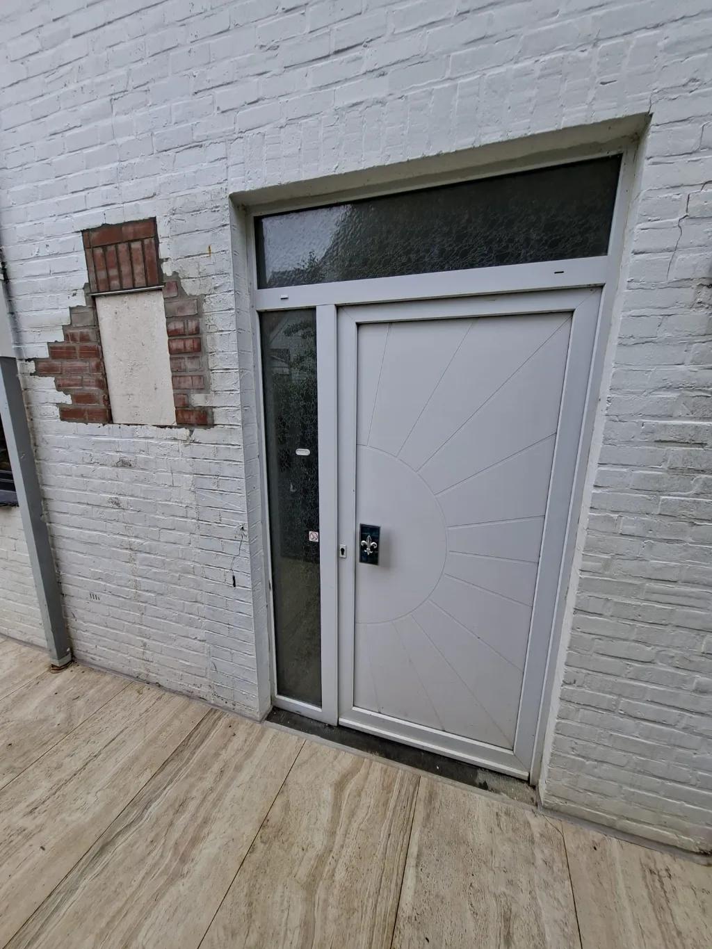 Before: old white entrance door