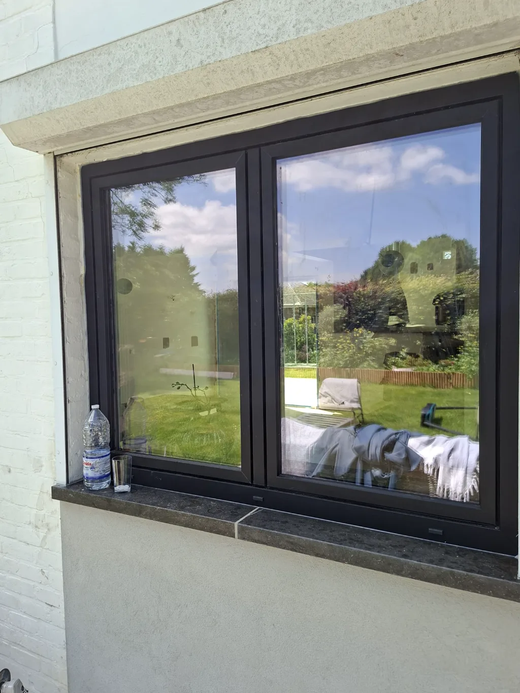 After: new band of black-framed windows
