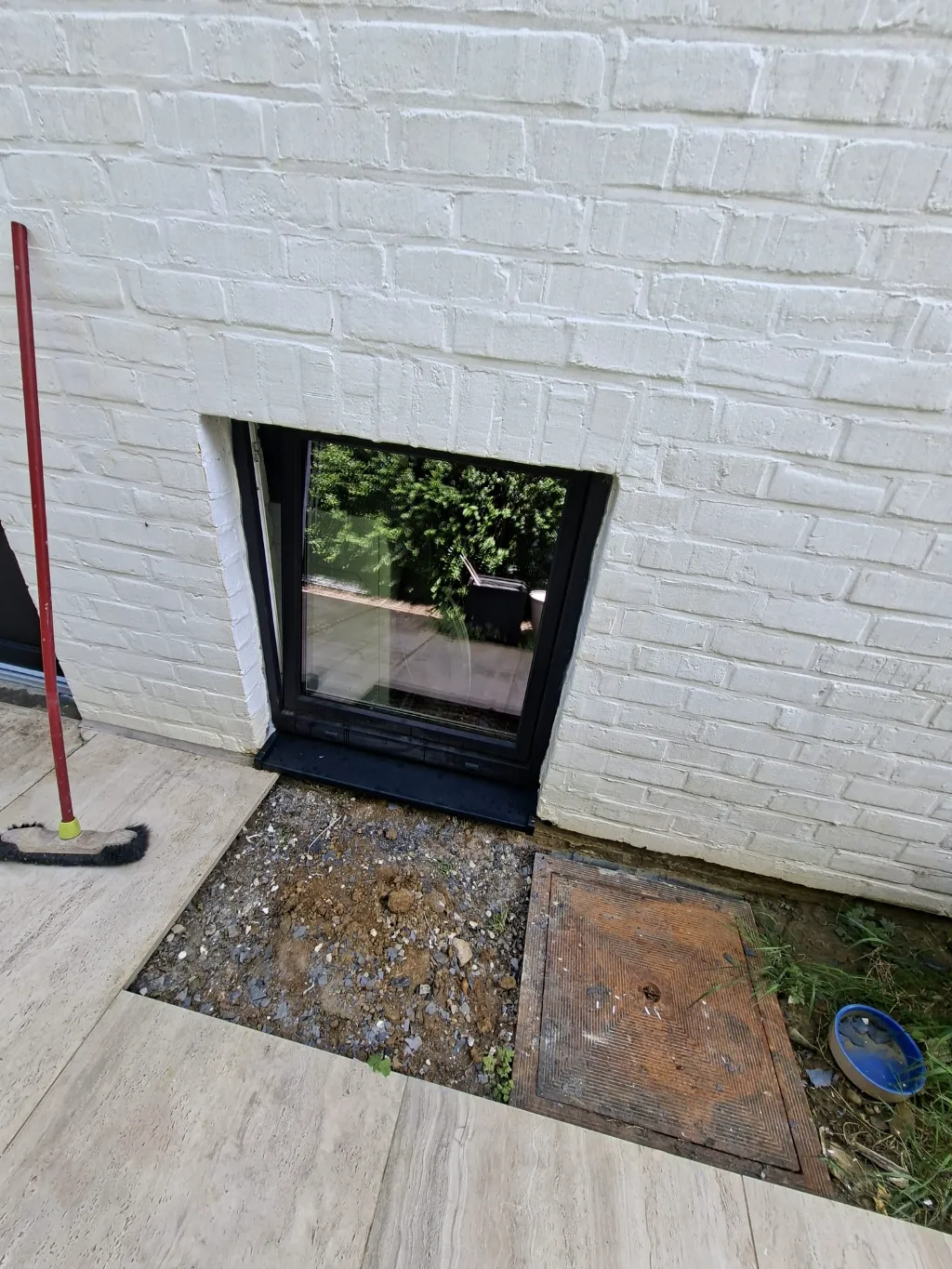 After: new black-framed cellar window