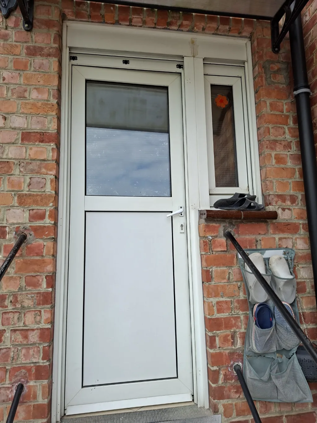 Before: old timber service door at the rear