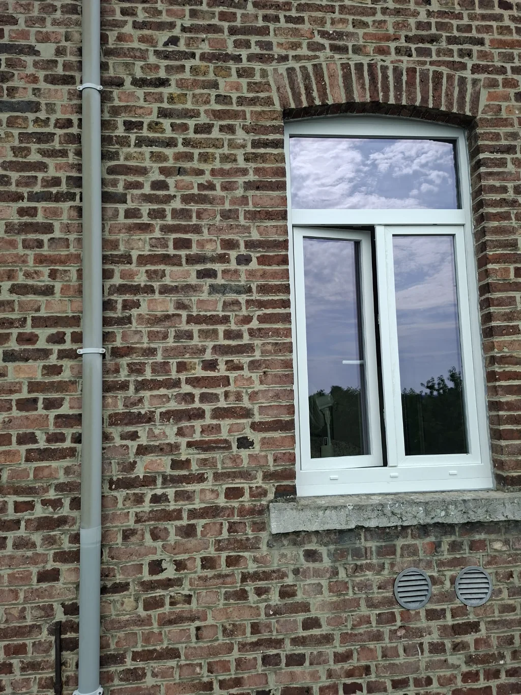 After: new white PVC roof window