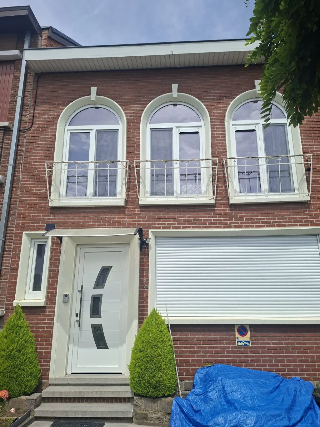 After: complete front façade renovated in white PVC