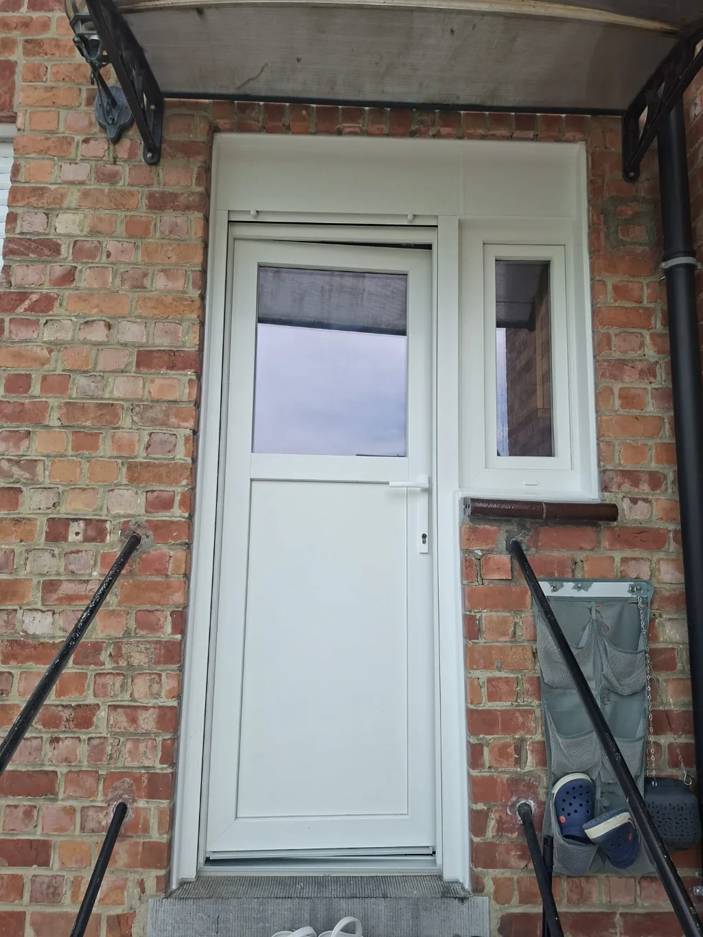 After: new PVC service door at the rear