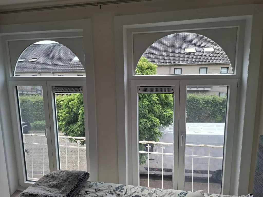After: new arched white PVC French doors in the bedroom