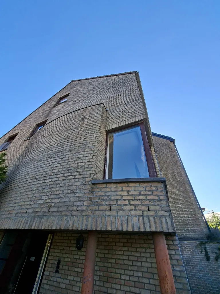 Before: rear façade with old timber windows