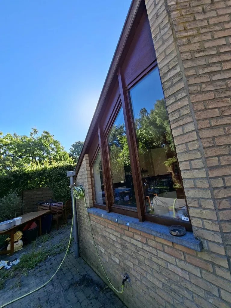 Before: old triangular timber window on the terrace side